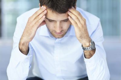 man with developing headache