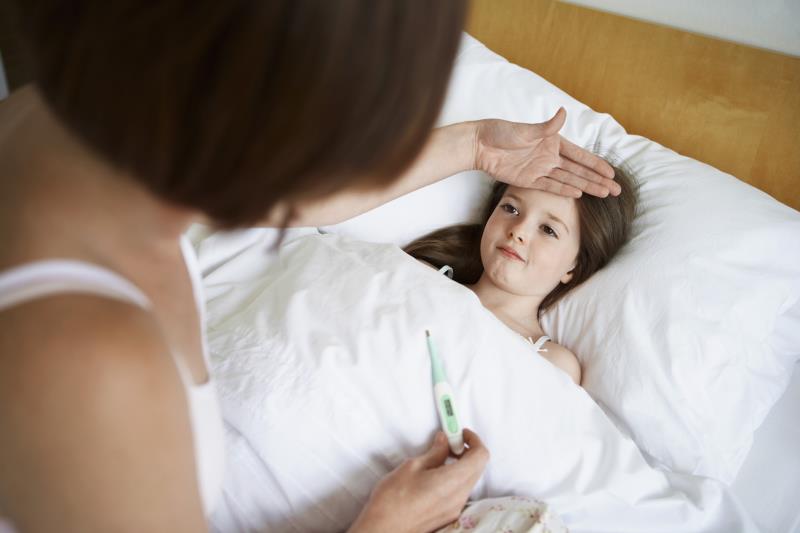 A mother, her daughter's temperature, a digital thermometer